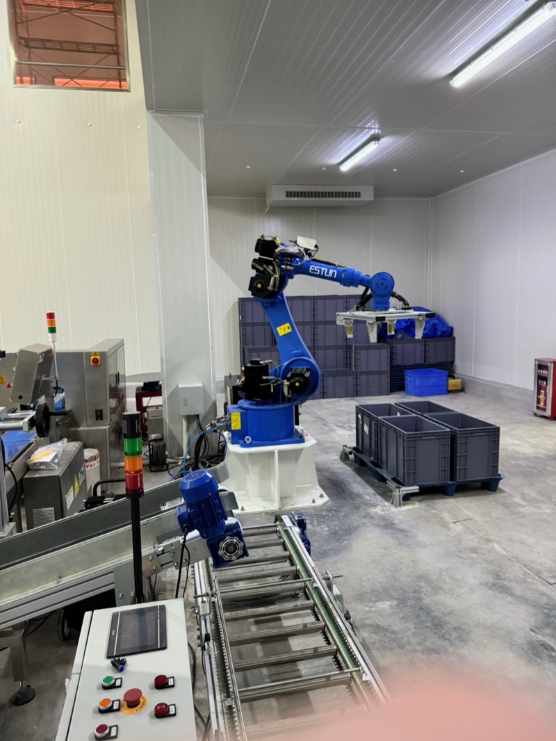 Industrial robotic arm for automated material handling in the grow facility